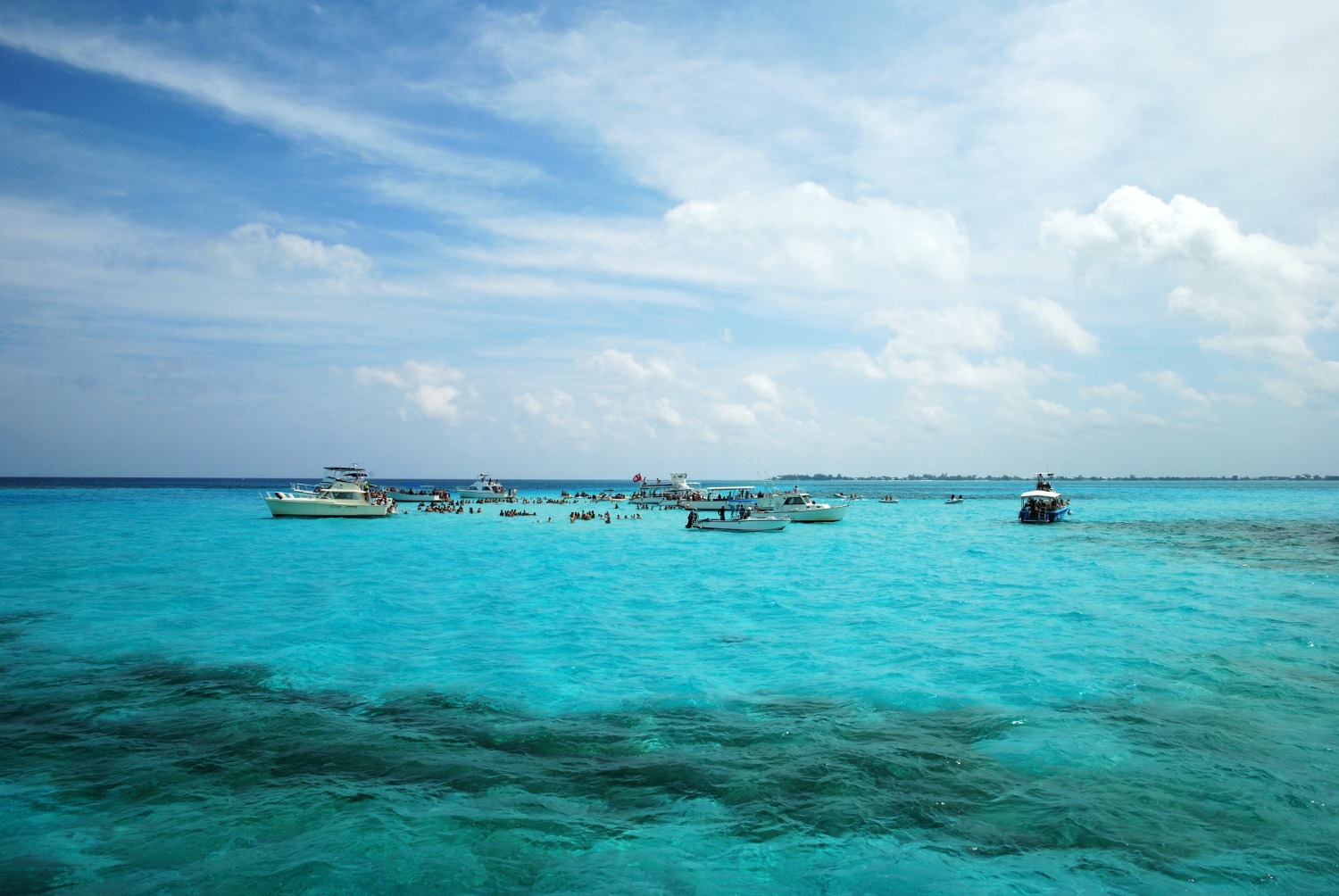 Boats at Stingray City in Grand Cayman - seeing stingrays in Cayman was one of the highlights of visiting the Cayman Islands while pregnant