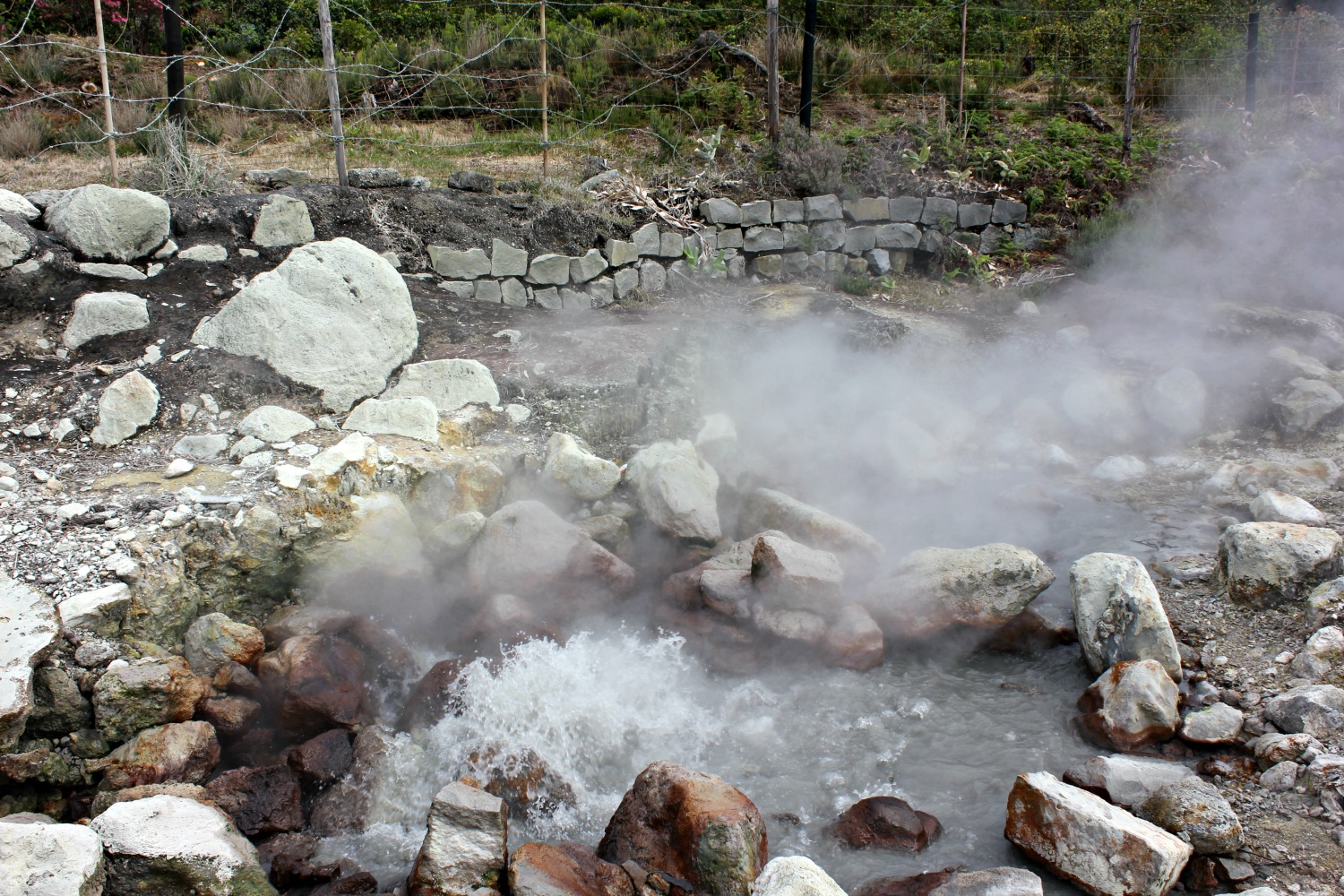 azores-volcanic-pool-water-boiling Steam and bubbles rising from the earth in the volcanic Azores