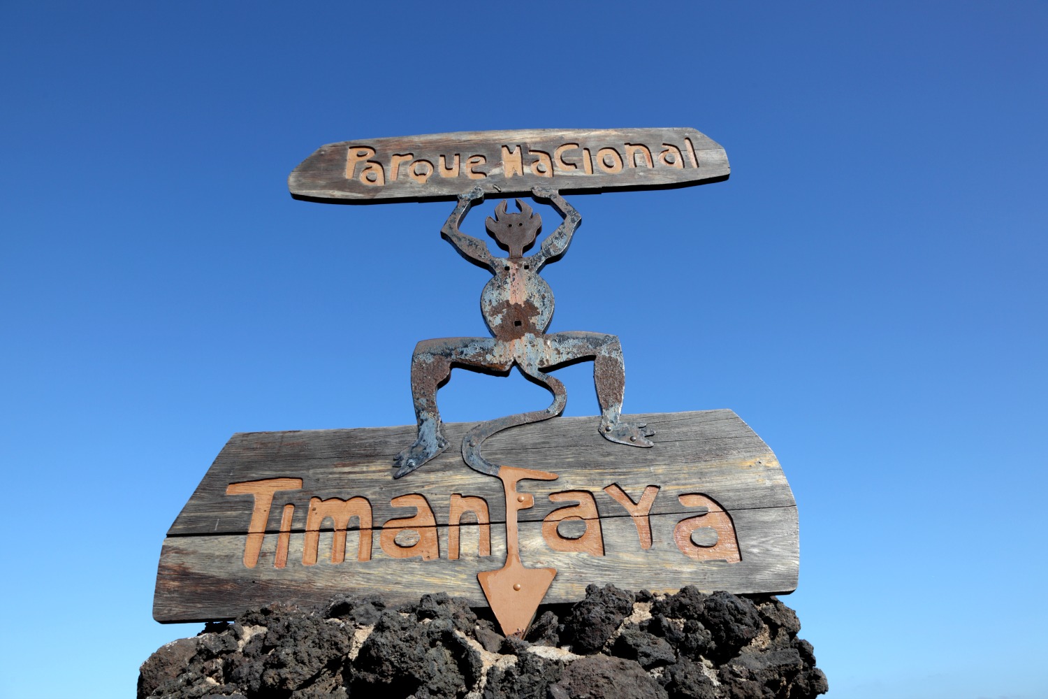 The devil sign at the entrance to Timanfaya National park in Lanzarote against a blue sky - my top things to do in Lanzarote with kids