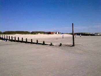 A view across the sand to the groynes at West Wittering - our day in Sussex at West Wittering with a baby and visiting the Crab and Lobster with kids