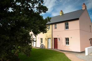 Pastel cottages at Bluestone Wales