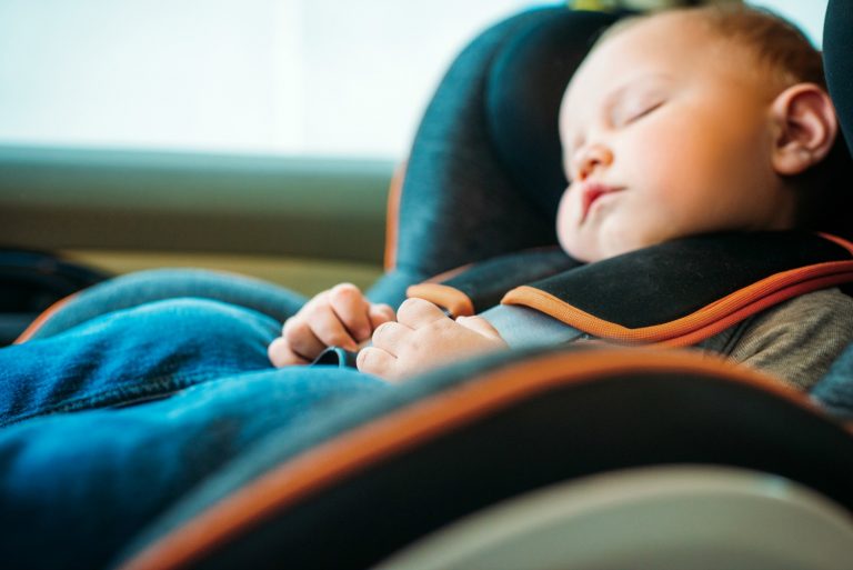 Young child asleep in a car seat - searching for the best Kiddicare car seat for my daughter and trying out their store service