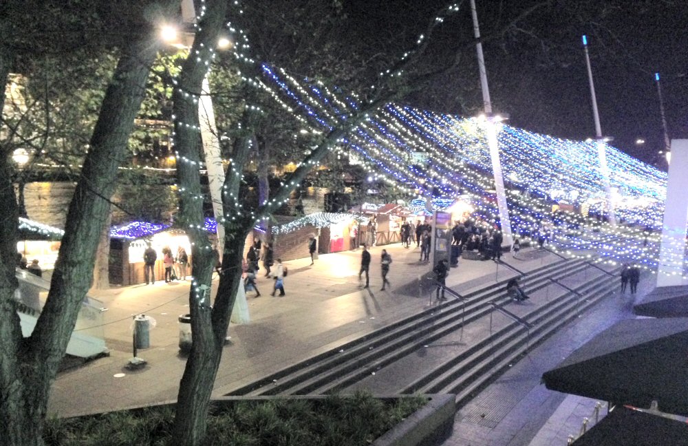 Looking down onto the lit up stalls and the Thames - feeling Christmassy with some Southbank mulled wine at the Christmas market on the South Bank