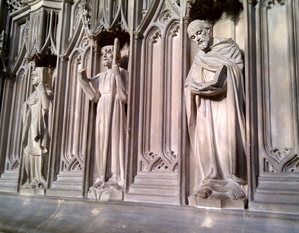 Carved stone statues in niches at Winchester cathedral