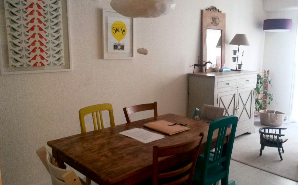 Wooden dining table and chairs in our Paris AirBNB