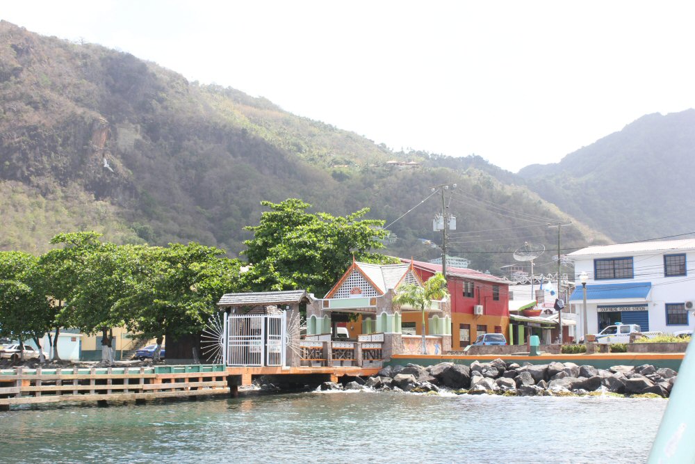 The brightly coloured buildings on the harbour at Soufriere, not far from the St Lucia volcano