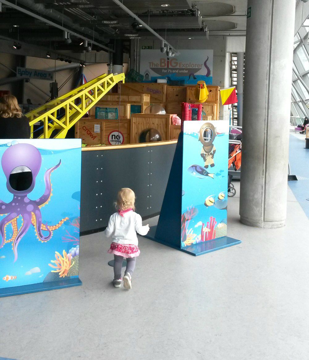 Toddler running through Glasgow Science Centre