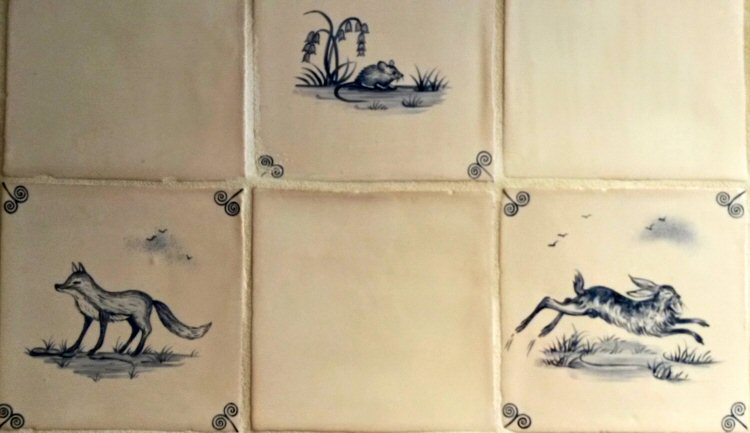 Tiles in the toilets at Packwood House National Trust property in Warwickshire