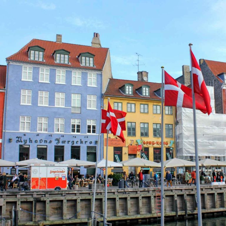 A view of the bright buildings in the harbour of Nyhavn - my guide to Copenhagen with kids