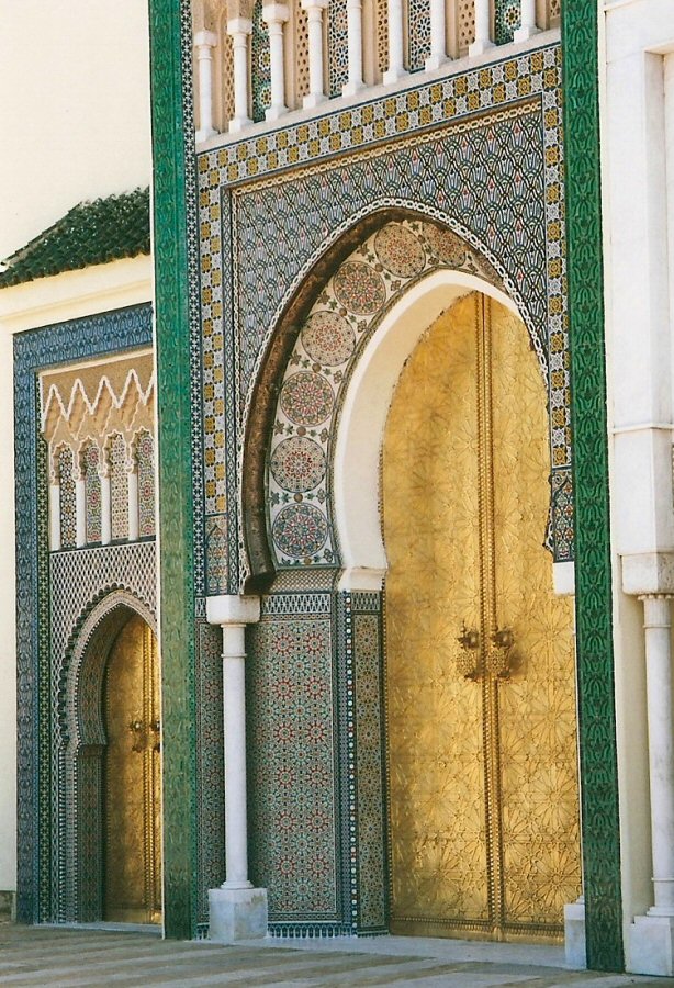 Intricate beaten golden door in Fes