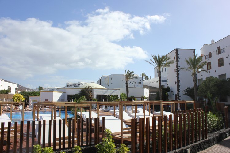 View onto the loungers by the pool at the Gran Castillo hotel in Lanzarote