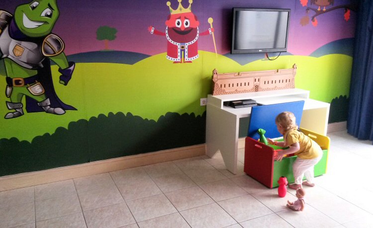 My toddler delves into the toybox in our room at the Gran Castillo hotel in Lanzarote