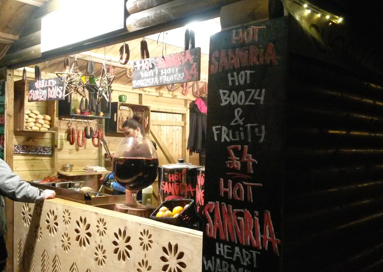 Hot drinks including hot sangria at one of the food stalls at the Christmas market on the South Bank in London
