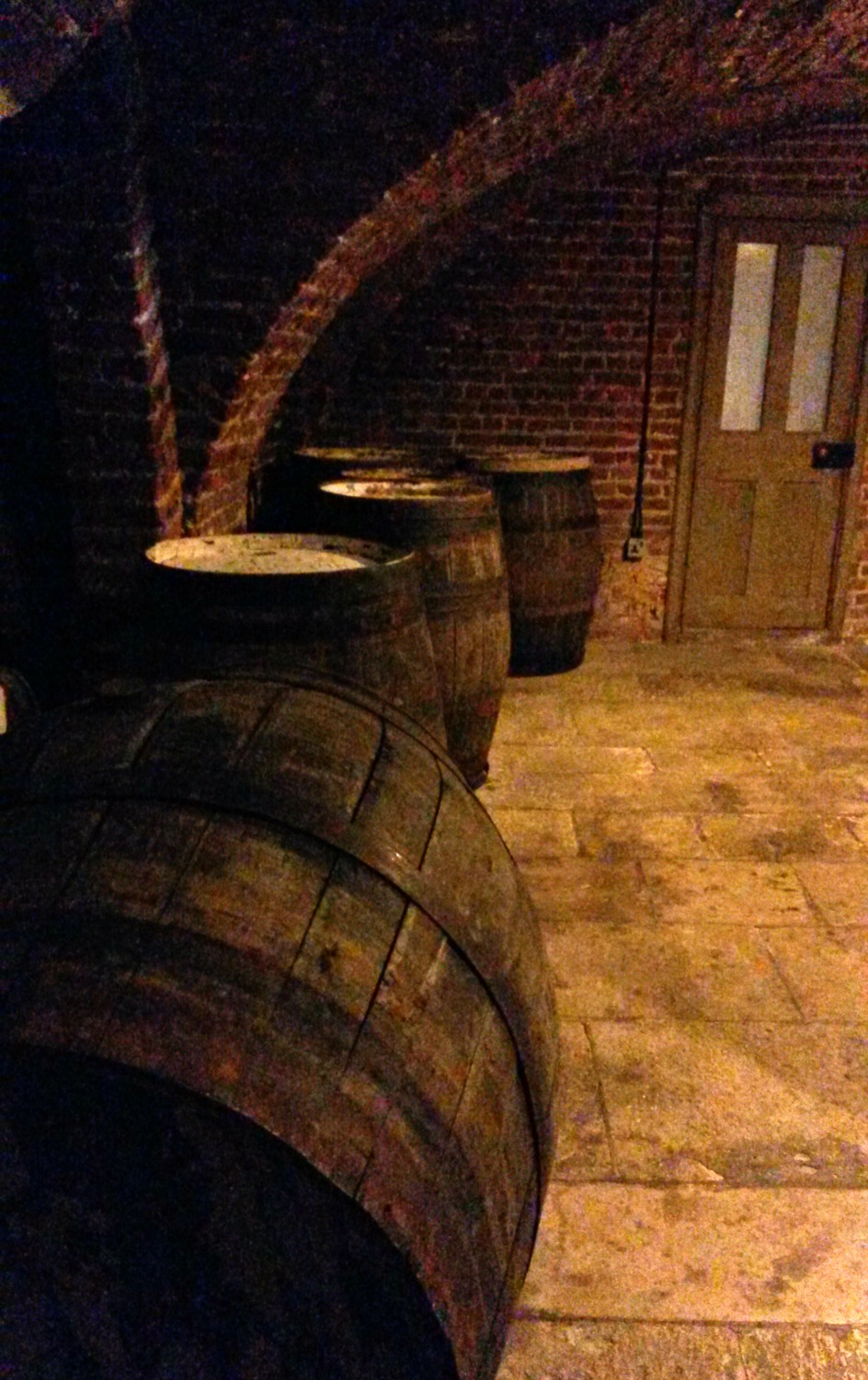 Barrels in the beer cellar at Ham House in Surrey
