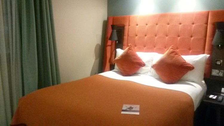 Double bed with plush orangey headboard at the Mercure London Bridge hotel - my review