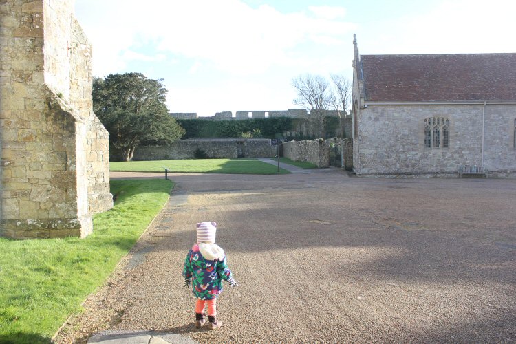 My daughter walks around Carisbrooke Castle on the Isle of Wight