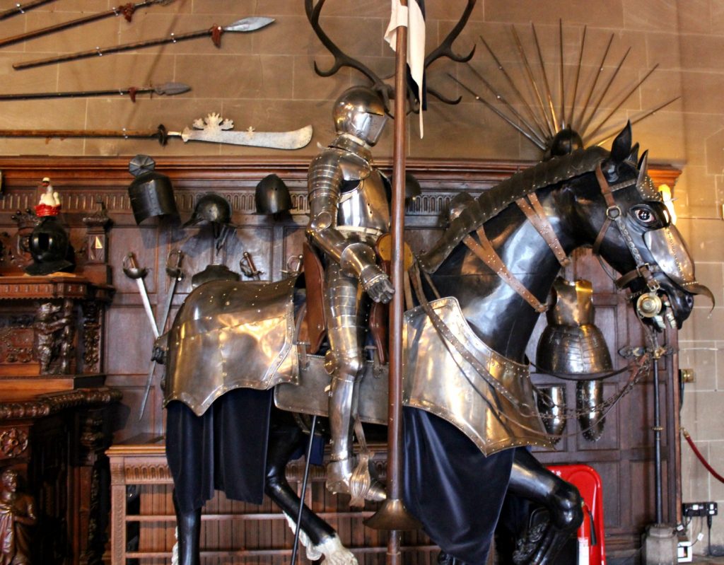 Suit of armour astride an armoured model horse in the great hall - visiting Warwick Castle with toddlers