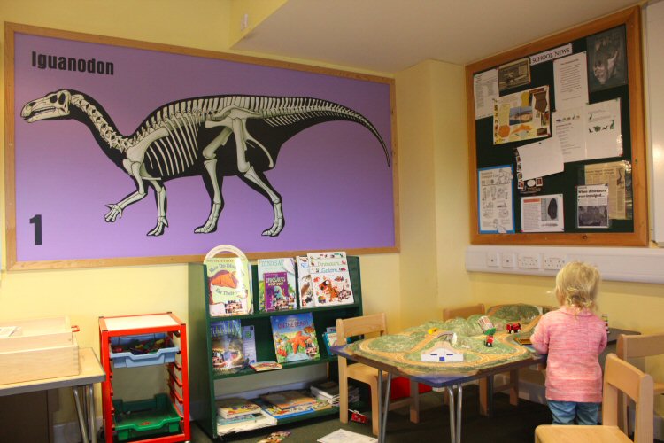 My toddler plays with some of the toys in the Education Room at the Isle of Wight's Dinosaur Isle