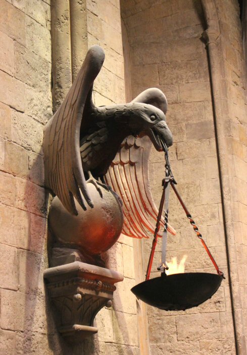 Carved bird holding a light on one of the walls of the Great Hall of Hogwarts set on the Harry Potter studio tour