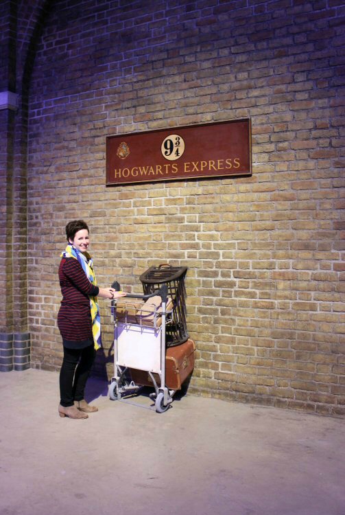 Me standing with luggage trolely at Platform 9 3/4 at the Warner Bros Harry Potter Studio tour