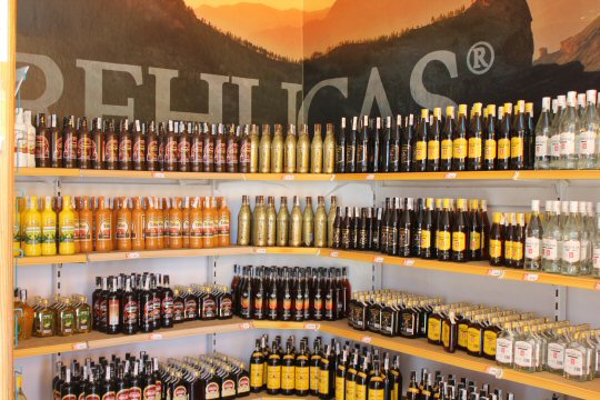Bottles stacked in the Arucas rum factory, including Gran Canaria honey rum