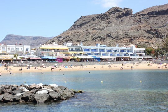 View of the beach in Puerto de Mogan, Gran Canaria from the ferry