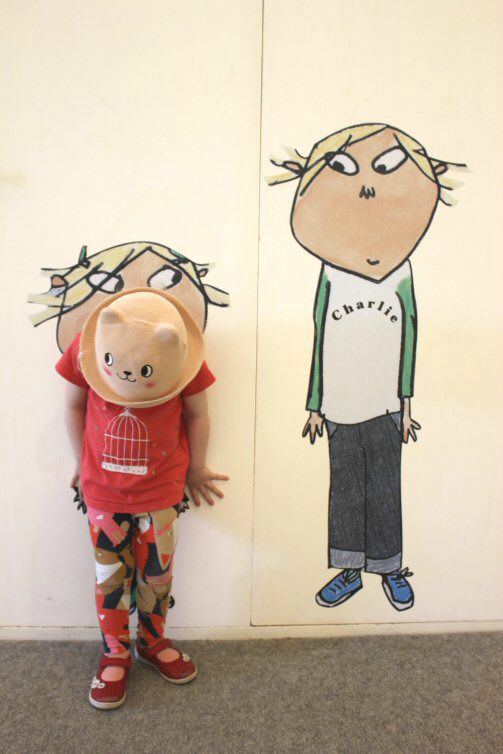 My daughter standing next to Charlie and Lola at the Lauren Child retrospective exhibition at Mottisfont National Trust property in Hampshire