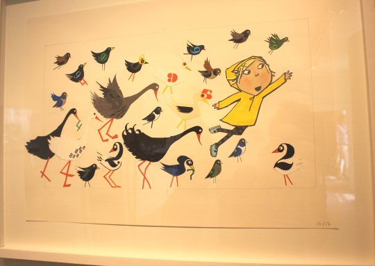 Illustration of Lola from the Charlie and Lola books in a yellow coat with birds