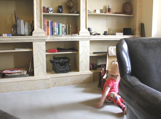 My toddler in one of the old rooms at Mottisfont in Hampshire