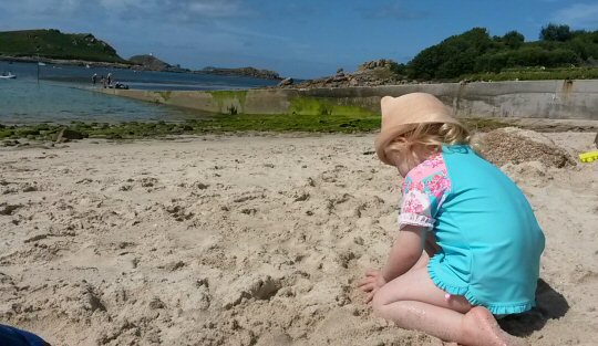 My daughter playing on the beach in her UV swimwear from Seafolly