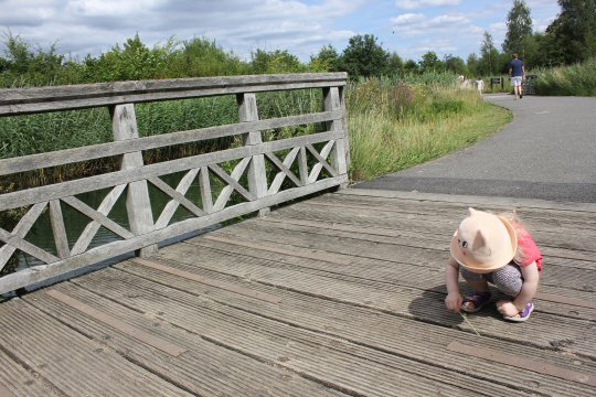 My daughter plays on one of the the wooden bridges at the London Wetland Centre