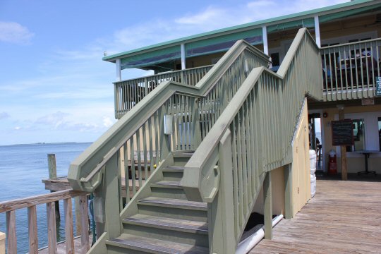Steps up to the restaurant at Rod & Reel Pier on Anna Maria Island in Florida