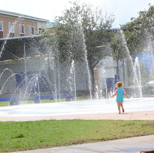 My daughter plays in the splash zone at the Bradenton Riverwalk
