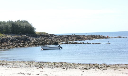 Boat moored by Porthloo beach on St Mary's in the Isles of Scilly