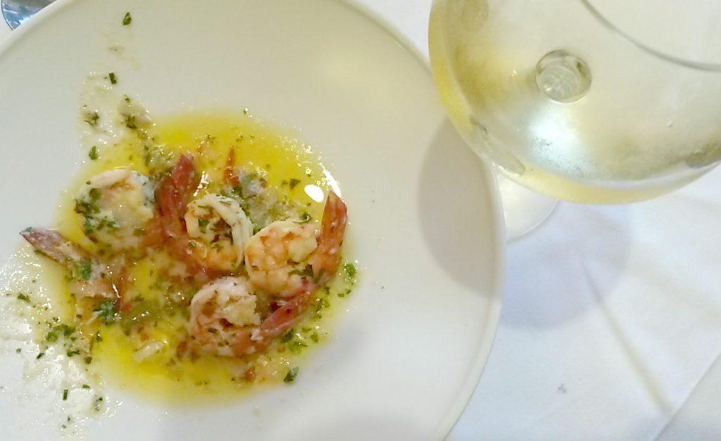Prawn dish with a glass of white wine at Tregarthen's Hotel Isles of Scilly - my review of Tregarthen's hotel with kids