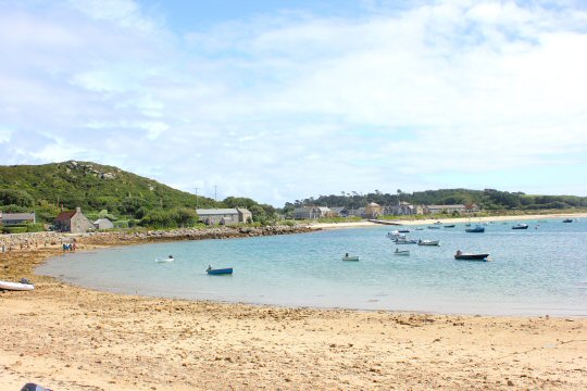 Boats in the bay by one of the beaches on Tresco - my reasons to visit the Isles of Scilly