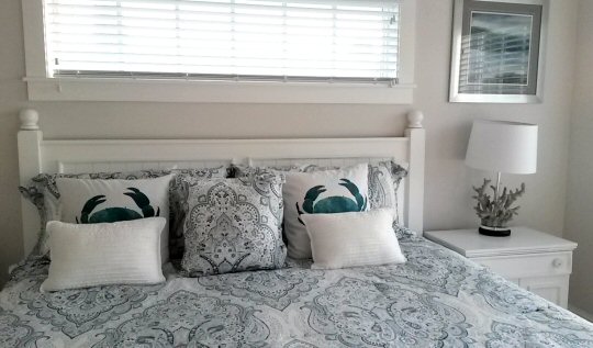 Cushions on the bed in one of the b edrooms of our holiday home, Anna Maria Island - Serenity Beach