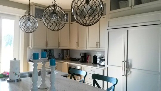 Small clear buoys in fishing nets used as lights in the kitchen of Serenity Beach, our Anna Maria Island holiday home