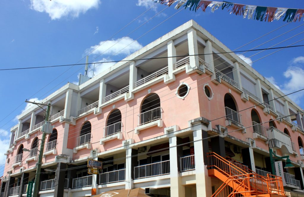 Brightly coloured buildings in St John's on Antigua - 14 reasons to visit Antigua with young kids