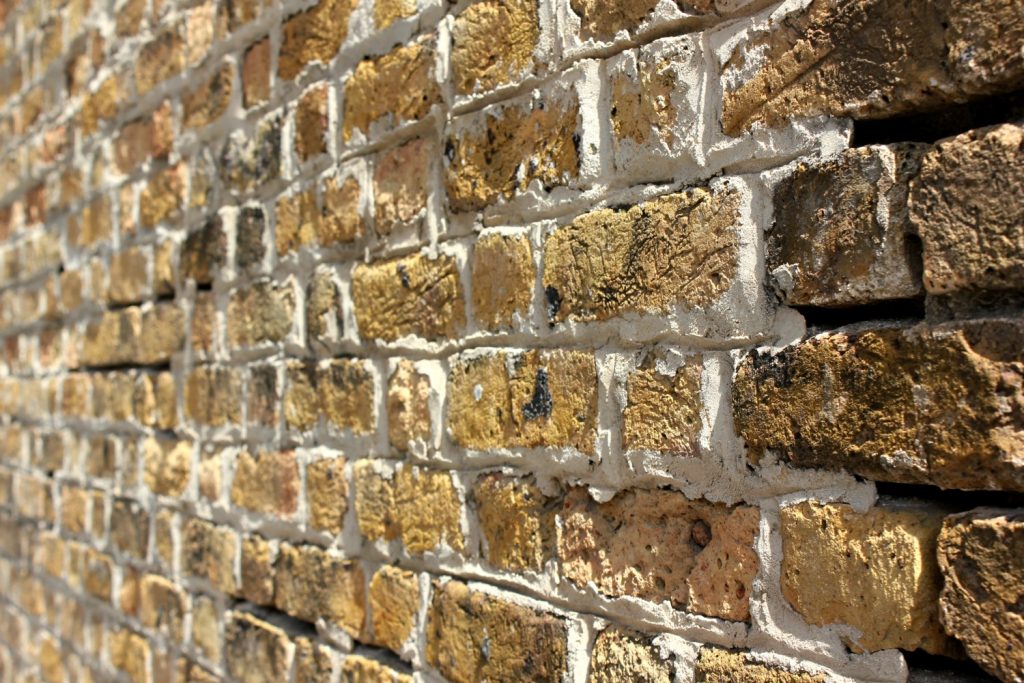 Close up of historic old golden bricks at Nelson's Dockyard Antigua