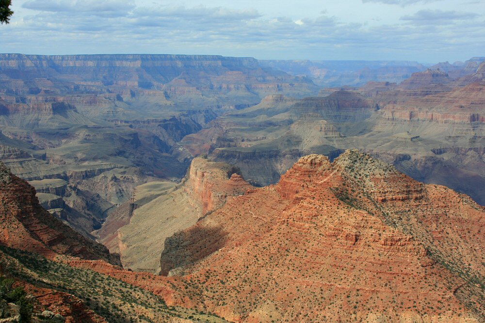 View of red rocks look out across the Grand Canyon