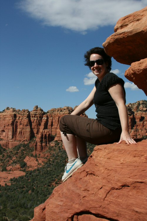 Me sitting on red rocks in Sedona, Arizona on a Pink Jeep tour