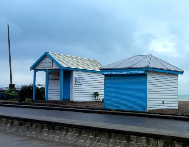 Two blue and white huts on the seafront in Brighton - my top things to do in Brighton with kids