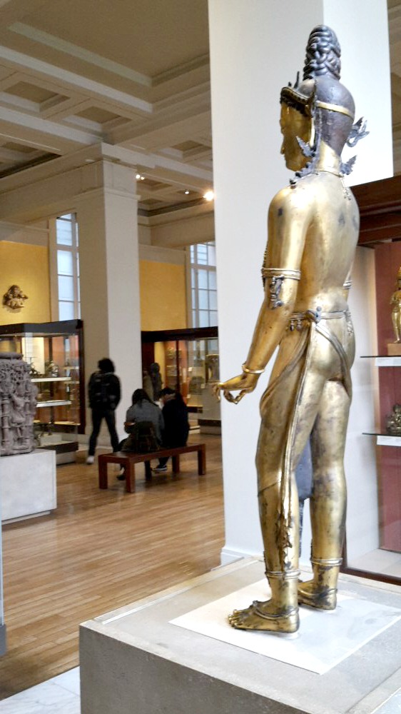 View of a golden Buddha statue in one of the Asia galleries as we followed the British Museum activity trail - visiting the British museum with kids