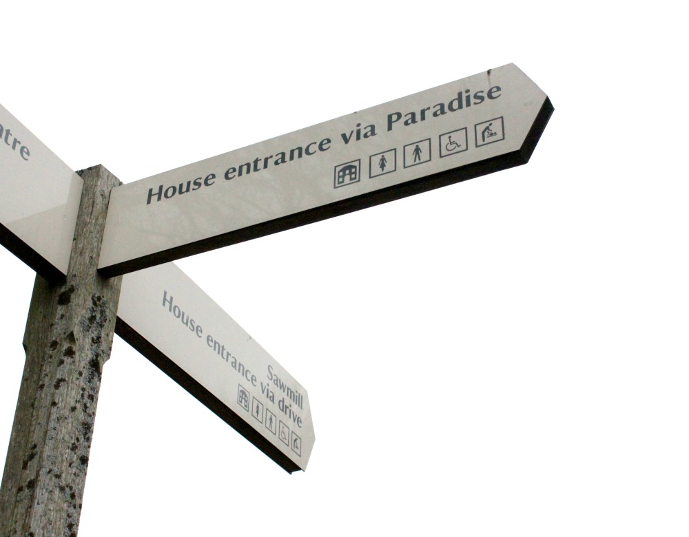 Sign showing the way to the entrance to Tyntesfield house 'via Paradise'