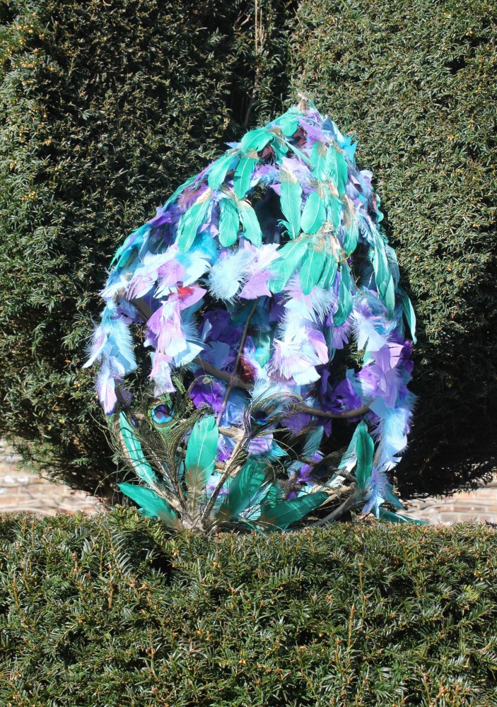 Egg made of bright feathers at Cliveden National Trust on our day out following the Easter Egg trail