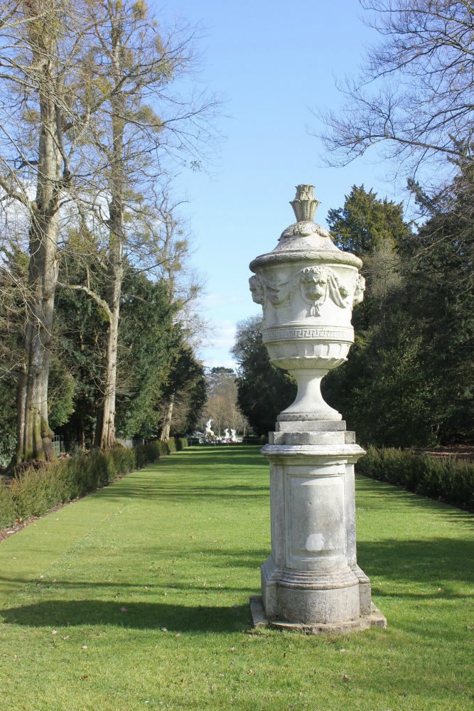 Stone urn on a pedestal in the gardens at Cliveden National Trust