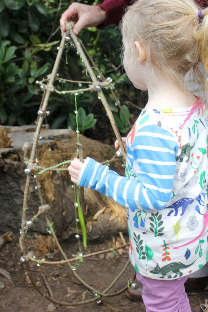 My daughter looking at bells on the Cliveden Easter Egg hunt