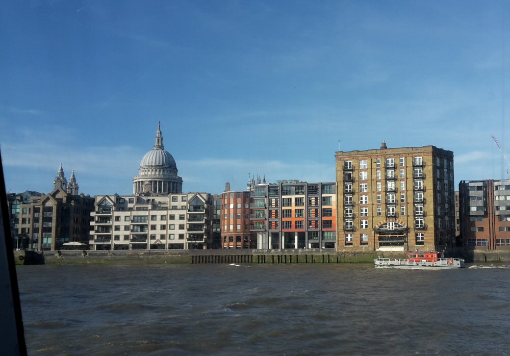 A view along the Thames to the buildings and dome of St Paul's cathedral - my list of the 22 top things to do on the Thames, London with kids or without