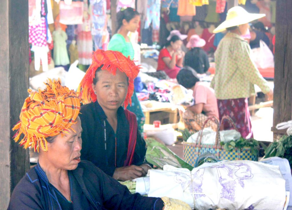 Women at a mark in Burma. With Burma newly opened up to tourists, and off the beaten track for most families, here are my 12 reasons to visit Burma (Myanmar) - in photos